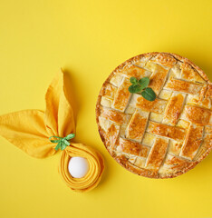 Neapolitan typical easter cake: pastiera on yellow bakground