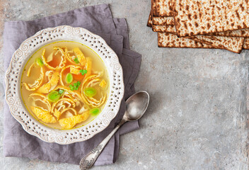 Vegetable broth with egg pancakes and matzo bread. Pesah celebration concept (jewish Passover holiday).