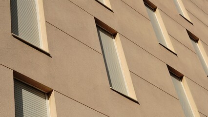 facade background with windows with shutters