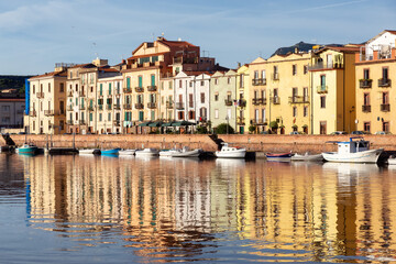 River with Homes and Apartments in Touristic Town. Bosa, Sardinia, Italy. Sunny Fall Season Day. Panorama