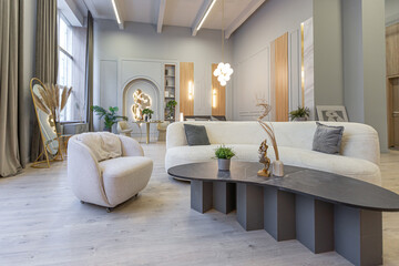 stylish luxury interior of modern studio apartment in green pastel colors with wooden elements. expensive furniture and decorations