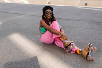  Urban woman enjoy outside. Modern woman posing with roller skates