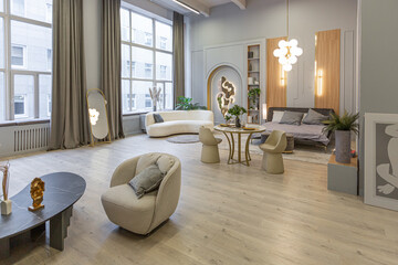 stylish luxury interior of modern studio apartment in green pastel colors with wooden elements. expensive furniture and decorations