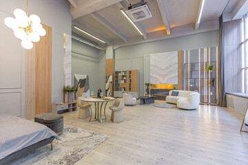 stylish luxury interior of modern studio apartment in green pastel colors with wooden elements. expensive furniture and decorations
