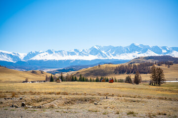 Fototapeta premium Scenic view with the beautiful mountain peaks with snow and glaciers, blue sky and the valley in the sunlight in Altai, Russia