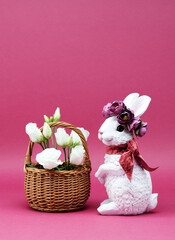 Easter Bunny and beautiful white flowers in a basket