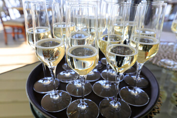 Champagne glasses on a background with windows.