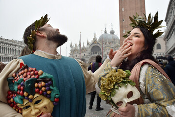 Couple of people dressed up for the Venice Carnival wearing Baco and Ariadna costumes
