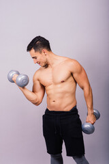 Fototapeta na wymiar Portrait young fitness sporty strong man bare-chested muscular sportsman isolated on grey dark.