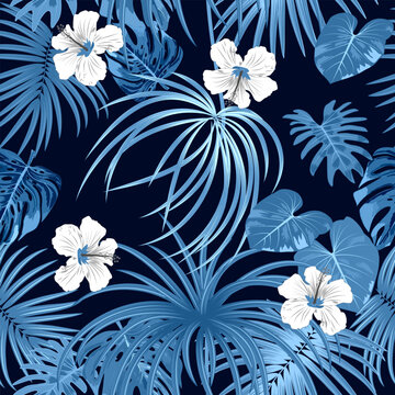 Seamless vector pattern monochrome blue palm tree leaves and white flowers on black background