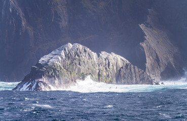 Rocky cliffs give place for flocks of seabirds at Cape Horn on Hornos Island in Chile