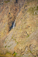 View from mountain pass Katu-Yaryk of waterfall, which falls from a cliff in, Altai, Russia
