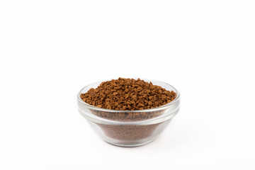 Instant coffee grains in a glass bowl isolated on white background.