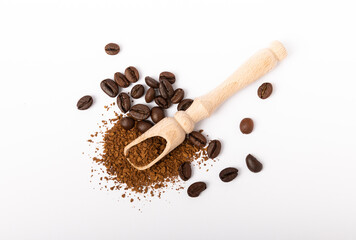 Soluble coffee grains in a wooden spoon isolated on a white background.