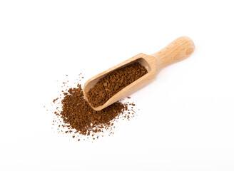Soluble coffee grains in a wooden spoon isolated on a white background.