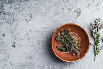 Fresh herbs still life on dark background, top view