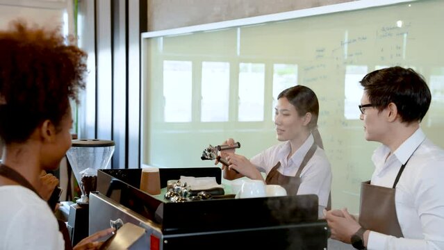 4K, female teacher teaches his two young students, use coffee handle this handle distill coffee water, make drink water coffee from handle, two stood listened attentively, intend write.