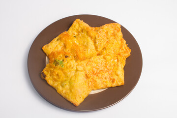 Fried Tempe is Indonesian famous food served on a plate with white background