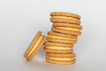 Fototapeta na wymiar Sandwich cookies with cream on white background.