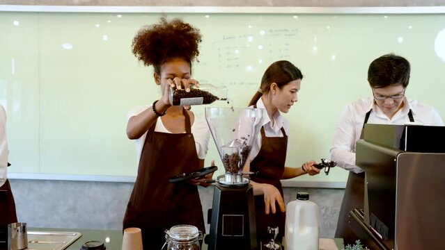 4K, teacher in coffee class is teaching students who attend class, get raw materials equipment ready, In order for students understand learn from first step, before starting process making coffee.