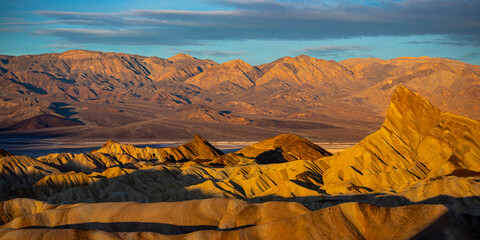 colorful sunrise in zabriskie point, death valley national park, california, usa; colorful...