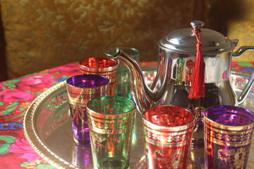Moroccan tea,Tea pouring into glass from metal teapot