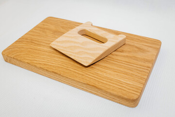 Сhildren's wooden knife on cutting board	