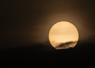 The sun slowly hides in the misty sunset!