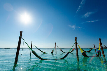 Woman on hammock in Bacalar lagoon Mexico - 574406212