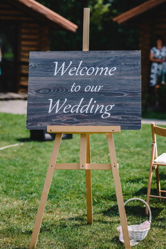 Sign for guests to help them to find the place of wedding, photo zone, cocktails, ceremony made from wood