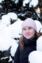 portrait of a girl in a snowy park in winter