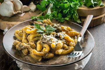 Homemade pasta with artichoke sauce on the plate