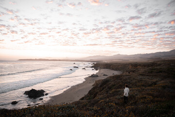 A wide landscape view of the coast of California during the sunset