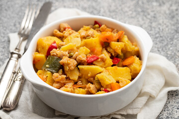Vegan stew soy meat and vegetables in bowl
