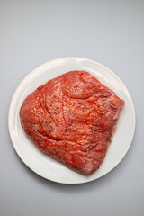 beef with marinate and black pepper on dish