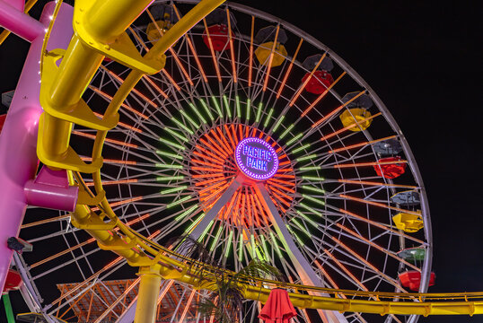 Los Angeles, United States - November 17, 2022: A picture of the colorful Pacific Wheel, on the Santa Monica Pier, at night.