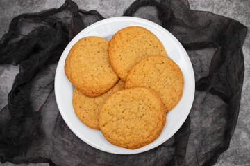 Few homemade cookies on white small dish