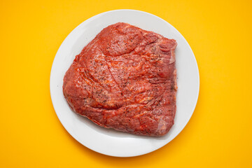 beef with marinate and black pepper on dish