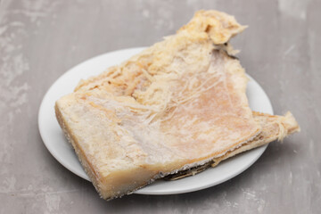 salted cod fish on white small dish