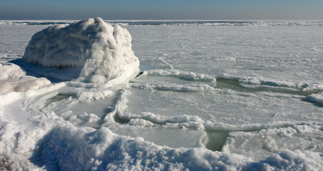 The Black Sea is frozen, ice floes float along the shore. Climate change, harsh winter