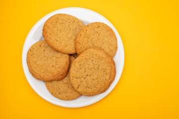 Few homemade cookies on white small dish