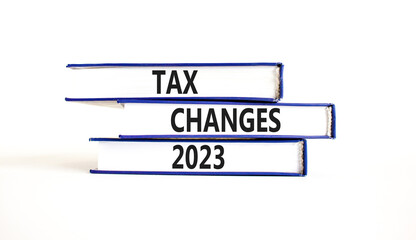 Tax changes 2023 symbol. Concept words Tax changes 2023 on books on a beautiful white table white background. Business Tax changes 2023 concept. Copy space.