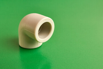 The connection angle of the thermoplastic pipe at an angle of 90 degrees. Concept of installation of water supply and sewage systems.