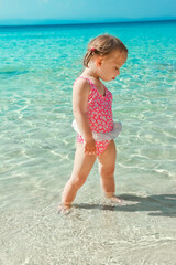 happy child playing by the sea
