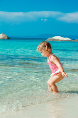 happy child playing by the sea