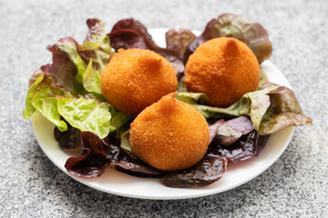 traditional brasilian fried drumsticks Coxinha de frango on dish