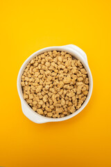 dry uncooked soya in white small bowl