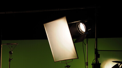 Film light for video production camera in studio set. Use as studio photo shoot light. Big LED spot light 5000w and diffuser or black panel create light like sun light can make daytime or golden hour