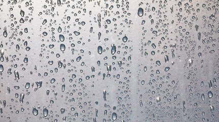 water drops on a window or in the shower cabin,wet transparent panorama background