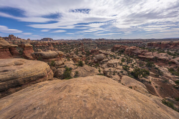 hiking the chesler park loop trail in the needles in canyonlands national park, usa